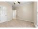 Carpeted bedroom with a window and closet for ample storage space at 10302 Sawtimber Ct, Huntersville, NC 28078