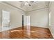 Large bedroom featuring hardwood floors, high ceilings, and a ceiling fan at 10302 Sawtimber Ct, Huntersville, NC 28078