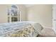 Bedroom with a large arched window and plush carpet at 10302 Sawtimber Ct, Huntersville, NC 28078