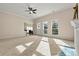 Bright and airy living room featuring neutral carpet and walls with natural light at 10302 Sawtimber Ct, Huntersville, NC 28078