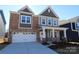 Brick and siding two-story home with a two-car garage at 11112 Lochmere Rd, Charlotte, NC 28278