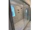 Spacious walk-in shower with glass enclosure and built-in seat at 11112 Lochmere Rd, Charlotte, NC 28278