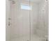 Large walk-in shower with built in seat and bright white tile at 1117 Churchill Commons Dr, Charlotte, NC 28211