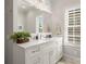 Bright bathroom with white vanity and large mirror at 1117 Churchill Commons Dr, Charlotte, NC 28211