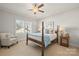 Charming bedroom with a wooden bed frame and window at 1117 Churchill Commons Dr, Charlotte, NC 28211