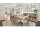 Elegant dining room featuring a large table, chandelier, and built-in cabinetry at 1117 Churchill Commons Dr, Charlotte, NC 28211