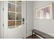 Bright foyer with white door, bench, and artwork at 1117 Churchill Commons Dr, Charlotte, NC 28211