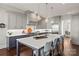 Modern kitchen featuring gray cabinets, quartz countertops, and stainless steel appliances at 1117 Churchill Commons Dr, Charlotte, NC 28211