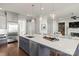 Modern kitchen island with seating, stainless steel appliances, and a large sink at 1117 Churchill Commons Dr, Charlotte, NC 28211