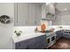 Modern kitchen with gray cabinetry, white countertops, and stainless steel appliances at 1117 Churchill Commons Dr, Charlotte, NC 28211