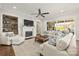 Cozy living room with fireplace, built-in shelving, and comfortable seating at 1117 Churchill Commons Dr, Charlotte, NC 28211