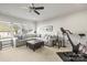 Bright recreation room with sectional sofa and exercise bike at 1117 Churchill Commons Dr, Charlotte, NC 28211