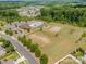 Aerial view of community amenities including pool, playground, and clubhouse at 11828 Bending Branch Rd # 42, Charlotte, NC 28227