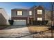 Two-story house with a two-car garage at night at 11828 Bending Branch Rd # 42, Charlotte, NC 28227