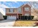 Brick two-story house with a two-car garage and landscaping at 11828 Bending Branch Rd # 42, Charlotte, NC 28227