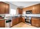 Modern kitchen with stainless steel appliances and ample wood cabinets at 11828 Bending Branch Rd # 42, Charlotte, NC 28227