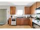 Well-equipped kitchen featuring wood cabinets and stainless steel appliances at 11828 Bending Branch Rd # 42, Charlotte, NC 28227