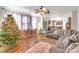 Spacious living room featuring hardwood floors, comfy seating, and a charming Christmas tree at 11828 Bending Branch Rd # 42, Charlotte, NC 28227