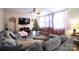 Bright living room with hardwood floors, large TV, and comfortable seating at 11828 Bending Branch Rd # 42, Charlotte, NC 28227