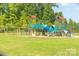 Modern playground with swings and climbing structures at 11828 Bending Branch Rd # 42, Charlotte, NC 28227