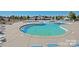 Community pool with relaxing lounge chairs at 11828 Bending Branch Rd # 42, Charlotte, NC 28227