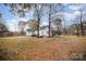 Large backyard with trees and outbuildings at 302 Charlotte St, York, SC 29745