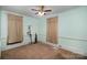 Bedroom with ceiling fan and two windows at 302 Charlotte St, York, SC 29745