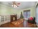 Living room with hardwood floors, fireplace, and built-in shelving at 302 Charlotte St, York, SC 29745