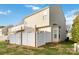 View of the backyard with a white privacy fence and the exterior of a two story home at 4609 Emily Pl, Rock Hill, SC 29732