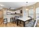 Inviting dining area with modern table, chairs, and adjacent open kitchen for easy entertaining at 4609 Emily Pl, Rock Hill, SC 29732