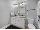 Shared bathroom with double vanity and granite countertop at 8411 Washoe Pine Ln, Charlotte, NC 28215