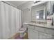 Shared bathroom with tub shower and granite vanity at 8411 Washoe Pine Ln, Charlotte, NC 28215