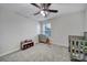 Bright bedroom with ceiling fan, dresser, and crib at 8411 Washoe Pine Ln, Charlotte, NC 28215