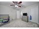 Spacious bedroom with ceiling fan and TV at 8411 Washoe Pine Ln, Charlotte, NC 28215