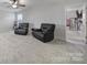 Bonus room with two recliners and access to another room at 8411 Washoe Pine Ln, Charlotte, NC 28215