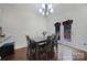 Dining room with hardwood floors, chandelier and access to backyard at 8411 Washoe Pine Ln, Charlotte, NC 28215