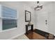 Bright entryway with hardwood floors, mirror and console table at 8411 Washoe Pine Ln, Charlotte, NC 28215