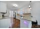 Kitchen with granite countertops, white cabinets and stainless steel appliances at 8411 Washoe Pine Ln, Charlotte, NC 28215