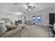 Spacious living room with gray sofas, coffee table, and hardwood floors at 8411 Washoe Pine Ln, Charlotte, NC 28215