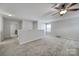 Bright loft area with carpeted floor and ceiling fan at 8411 Washoe Pine Ln, Charlotte, NC 28215