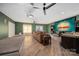 Entertainment basement with comfortable seating, large screen, and wood flooring for ultimate enjoyment at 1115 Stony Point Rd, Kings Mountain, NC 28086