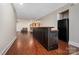 Well-lit basement with a custom bar, a refrigerator, and plenty of space for entertaining guests at 1115 Stony Point Rd, Kings Mountain, NC 28086