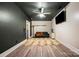Finished basement offering comfortable seating, a mounted TV, hardwood floors, and ample space at 1115 Stony Point Rd, Kings Mountain, NC 28086