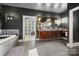 Modern bathroom featuring double sink vanity, tile flooring, and a luxurious soaking tub at 1115 Stony Point Rd, Kings Mountain, NC 28086
