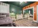 Bright bedroom with wood floors, complemented by mirrored closet doors and classic white furniture at 1115 Stony Point Rd, Kings Mountain, NC 28086