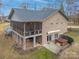 Elevated exterior view of a brick home, showing screened-in porch and backyard with hot tub at 1115 Stony Point Rd, Kings Mountain, NC 28086