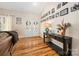Bright foyer with hardwood floors, decorative console table, and a gallery wall of photos for a personalized touch at 1115 Stony Point Rd, Kings Mountain, NC 28086