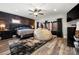 Spacious bedroom with a modern design, featuring a striking accent wall and hardwood floors at 1115 Stony Point Rd, Kings Mountain, NC 28086