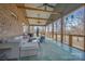 Relax on this screened porch with cozy seating, perfect for enjoying peaceful outdoor living at 1115 Stony Point Rd, Kings Mountain, NC 28086