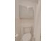 Cozy bathroom with a toilet, shower curtain, and frosted storage cabinet at 1300 Queens Rd # 303, Charlotte, NC 28207